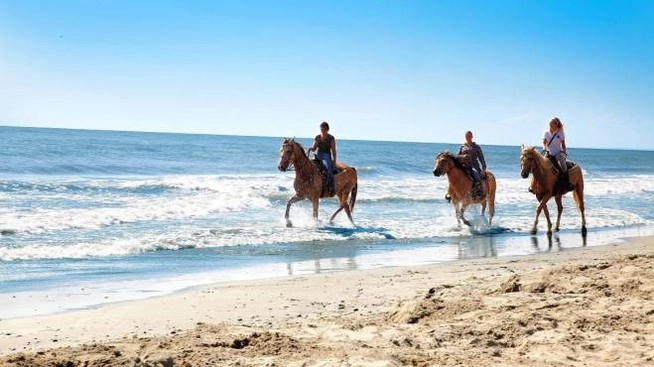 A cavallo in spiaggia
