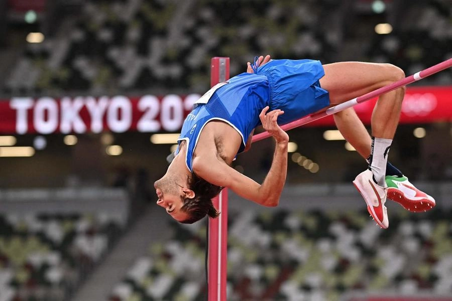Italy's Gianmarco Tamberi competes in the men's high jump final during the Tokyo 2020 Olympic Games at the Olympic Stadium in Tokyo on August 1, 2021. (Photo by Ben STANSALL / AFP)