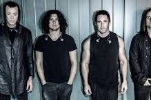 Nine Inch Nails; il terzo da sinistra è Trent Reznor. Alessandro Cortini il primo a destra