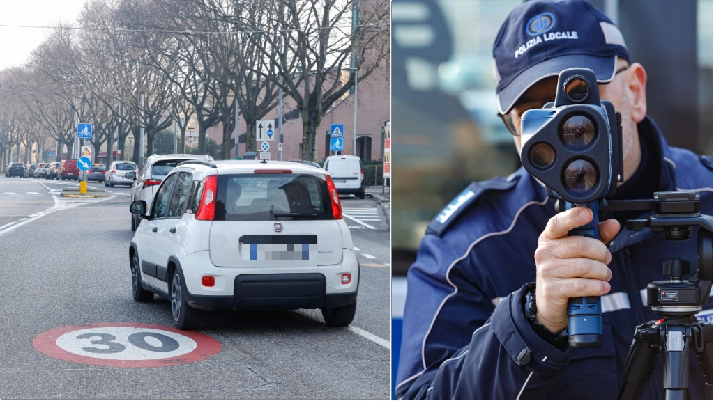 Traffico in città a Bologna col limite dei 30 all'ora e vigili in azione