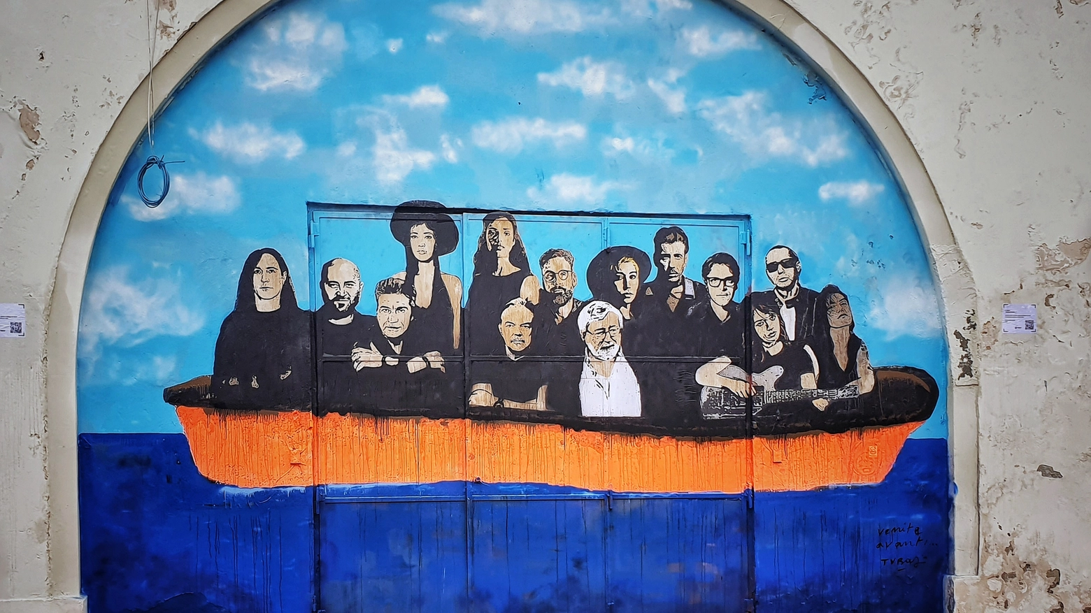 Murale con Francesco Guccini e altri sotto il ponte di via Libia a Bologna (Dire)