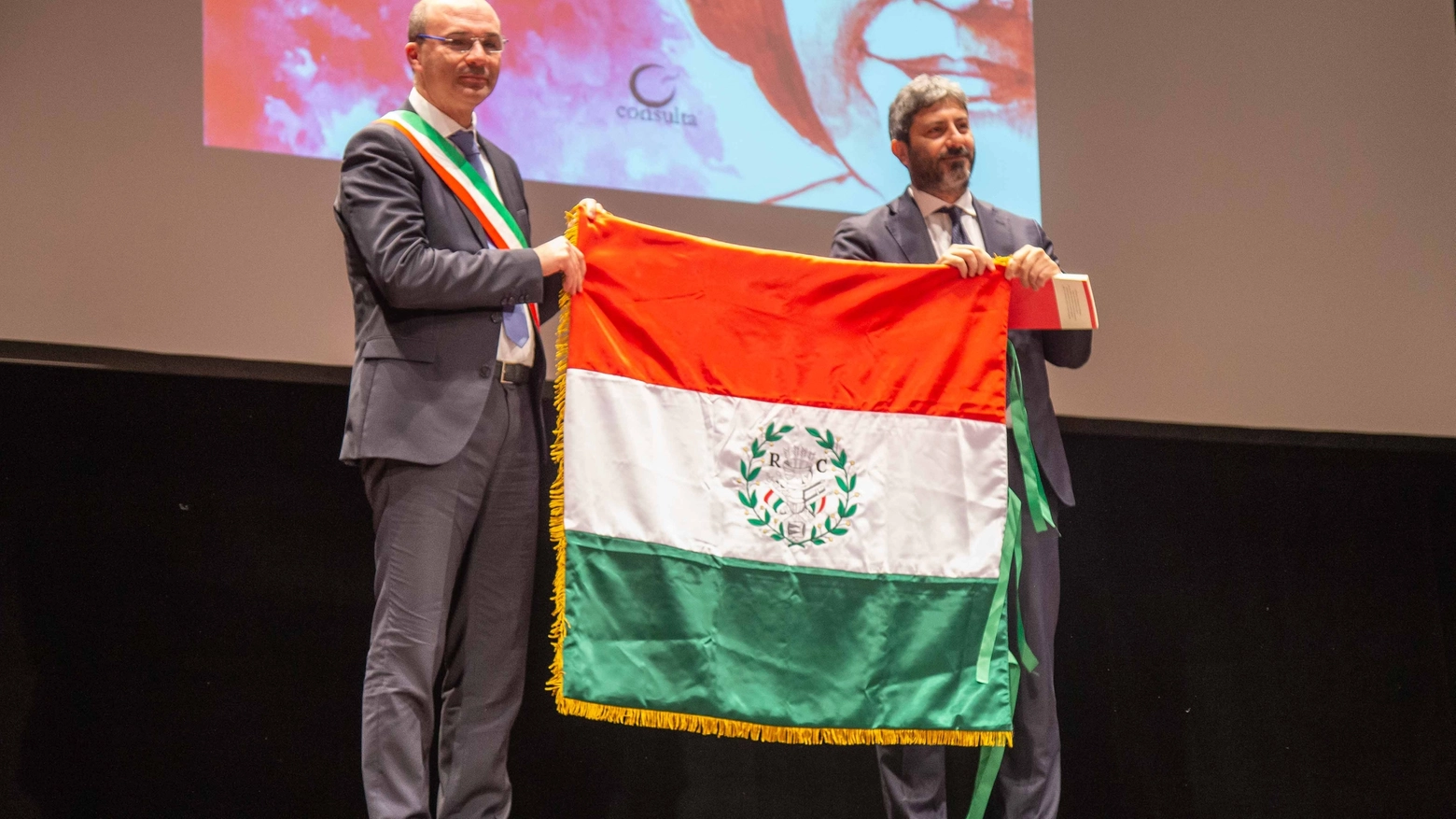 Il presidente della Camera, Roberto Fico riceve il Primo Tricolore dal sindaco Luca Vecchi