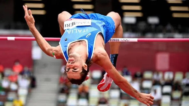epa09378443 Gianmarco Tamberi of Italy competes in the Men's High Jump qualification during the Athletics events of the Tokyo 2020 Olympic Games at the Olympic Stadium in Tokyo, Japan, 30 July 2021.  EPA/CHRISTIAN BRUNA